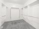 Walk-in closet with carpet and custom shelving at 3528 Tack St, Las Vegas, NV 89122