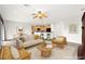Bright living room features neutral furniture, a ceiling fan, and an open floor plan to the kitchen at 3528 Tack St, Las Vegas, NV 89122
