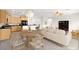 Open concept living space with kitchen, dining area, and Gathering room at 3528 Tack St, Las Vegas, NV 89122
