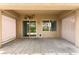 Spacious covered patio with stone flooring, offering a comfortable outdoor living space at 3528 Tack St, Las Vegas, NV 89122
