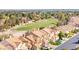 Beautiful aerial view of townhomes overlooking a golf course in a well-landscaped neighborhood at 5492 Royal Vista Ln, Las Vegas, NV 89149