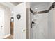 This is a bathroom shower featuring marble-look walls, bronze trim and faucet, and glass enclosure at 5492 Royal Vista Ln, Las Vegas, NV 89149
