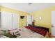 Brightly lit bedroom featuring double closet and access to an ensuite bathroom for added convenience at 5492 Royal Vista Ln, Las Vegas, NV 89149