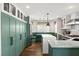 A bright kitchen with modern cabinetry, a corner dining nook, an island and stainless steel appliances at 5492 Royal Vista Ln, Las Vegas, NV 89149