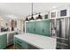Spacious kitchen featuring a large island, stainless steel appliances, and ample cabinet space at 5492 Royal Vista Ln, Las Vegas, NV 89149