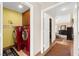 Bright laundry area conveniently located near bedroom and featuring bold red washer and dryer at 5492 Royal Vista Ln, Las Vegas, NV 89149