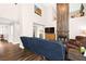 Spacious living room with dark wood floors, fireplace, and high ceilings, creating a comfortable space at 5492 Royal Vista Ln, Las Vegas, NV 89149