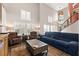 Open living room features hardwood floors, natural light, and staircase at 5492 Royal Vista Ln, Las Vegas, NV 89149