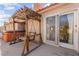 Enjoy this private patio with swing and access to a hot tub for outdoor relaxation at 5492 Royal Vista Ln, Las Vegas, NV 89149