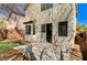 The backyard boasts a concrete patio, sliders, stucco, artificial grass, and perimeter brick at 6267 Dollar Bill Ct, Las Vegas, NV 89141