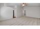 Spacious carpeted bedroom features a ceiling fan and ensuite bathroom at 6267 Dollar Bill Ct, Las Vegas, NV 89141