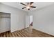 Bright bedroom featuring plank floors, closet, and a door leading to the stairs at 6267 Dollar Bill Ct, Las Vegas, NV 89141