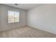 This cozy carpeted bedroom offers neutral decor and great natural light at 6267 Dollar Bill Ct, Las Vegas, NV 89141