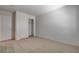Neutral carpeted bedroom features a standard closet and adjacent doors at 6267 Dollar Bill Ct, Las Vegas, NV 89141