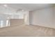 Bright loft space featuring neutral carpet, modern lighting, and access to other rooms at 6267 Dollar Bill Ct, Las Vegas, NV 89141