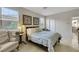 Bright bedroom with large windows, neutral walls, and tile flooring at 703 Shiva St, Las Vegas, NV 89178