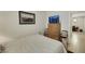 Well-lit bedroom featuring a full bed and a view of the kitchen at 703 Shiva St, Las Vegas, NV 89178