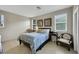 Bright bedroom with large windows, neutral walls, and tile flooring at 703 Shiva St, Las Vegas, NV 89178
