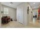 Bright hallway with tiled floor leading to multiple rooms, showcasing open floor plan at 703 Shiva St, Las Vegas, NV 89178