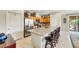 Open kitchen features an eat-in island with seating, stainless steel appliances, and ample storage space at 703 Shiva St, Las Vegas, NV 89178