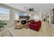 Comfortable living room with neutral walls, tile floors, and an abundance of natural light at 703 Shiva St, Las Vegas, NV 89178