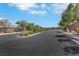 Street view of a neighborhood with lush landscaping and an elegant gated entrance at 703 Shiva St, Las Vegas, NV 89178