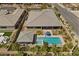 Aerial view of a luxury home with a large pool, spa, landscaped backyard, and covered patio at 7477 Triple Knot Ct, Las Vegas, NV 89113