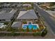 Overhead drone view of a luxury home and the backyard complete with pool and patio at 7477 Triple Knot Ct, Las Vegas, NV 89113
