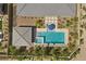 Aerial view of backyard featuring pool, spa, covered seating area, and manicured landscaping at 7477 Triple Knot Ct, Las Vegas, NV 89113