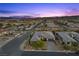 Aerial view of property showcasing the home's exterior and surrounding neighborhood at 7477 Triple Knot Ct, Las Vegas, NV 89113