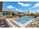 The backyard features a pool and jacuzzi, with ample space to relax and soak up the sun at 7477 Triple Knot Ct, Las Vegas, NV 89113