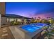 The backyard features a pool and jacuzzi, set amongst lush landscaping, creating a private oasis at 7477 Triple Knot Ct, Las Vegas, NV 89113