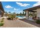 Backyard with pool, spa, patio and lush landscaping creating a private retreat at 7477 Triple Knot Ct, Las Vegas, NV 89113