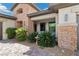 Charming exterior with stone accents, manicured landscaping, and inviting entrance at 7477 Triple Knot Ct, Las Vegas, NV 89113