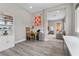 Functional home office space featuring a desk, chair, and view of the bedroom offering a versatile workspace at 7477 Triple Knot Ct, Las Vegas, NV 89113
