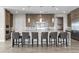 A gourmet kitchen features a large island, breakfast bar, stainless appliances, and ample counter space at 7477 Triple Knot Ct, Las Vegas, NV 89113