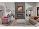 A cozy living room features a fireplace, comfortable seating, and plenty of natural light at 7477 Triple Knot Ct, Las Vegas, NV 89113