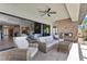 Spacious living room with fireplace and sliding doors to covered outdoor space at 7477 Triple Knot Ct, Las Vegas, NV 89113