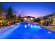 Inviting backyard pool and spa featuring a pool house with an outdoor seating area at 7477 Triple Knot Ct, Las Vegas, NV 89113
