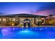 Backyard oasis featuring a pool, outdoor seating and lush landscaping, perfect for relaxation and entertainment at 7477 Triple Knot Ct, Las Vegas, NV 89113