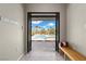 Entrance to a backyard pool area featuring a wooden bench, an outdoor shower, and a view of the pool at 7477 Triple Knot Ct, Las Vegas, NV 89113