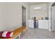 Charming pool house features a beverage fridge, bench, and access to a tiled shower, blending comfort and convenience at 7477 Triple Knot Ct, Las Vegas, NV 89113