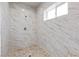 Elegant shower space with a rainfall shower head and sleek tile for a spa-like experience in the pool house at 7477 Triple Knot Ct, Las Vegas, NV 89113