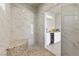 Luxurious pool house shower featuring stylish tile work and a built-in bench for ultimate comfort and convenience at 7477 Triple Knot Ct, Las Vegas, NV 89113