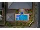 Aerial view of a modern pool with spa and meticulously landscaped backyard at 7477 Triple Knot Ct, Las Vegas, NV 89113