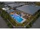 Aerial view of a modern pool, spa, outdoor living spaces and manicured landscaping at 7477 Triple Knot Ct, Las Vegas, NV 89113