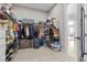 Large walk-in closet with extensive storage solutions and access to the main room at 7477 Triple Knot Ct, Las Vegas, NV 89113