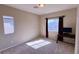 Bright bedroom featuring natural light, neutral walls, and a desk, creating a cozy, adaptable space at 7788 Ebro Valley Ct, Las Vegas, NV 89113