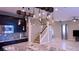 Open kitchen featuring granite countertops, dark cabinetry, and an open floor plan at 7788 Ebro Valley Ct, Las Vegas, NV 89113