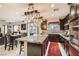 Spacious kitchen with granite countertops, dark cabinetry, stainless appliances, and an open floor plan at 7788 Ebro Valley Ct, Las Vegas, NV 89113